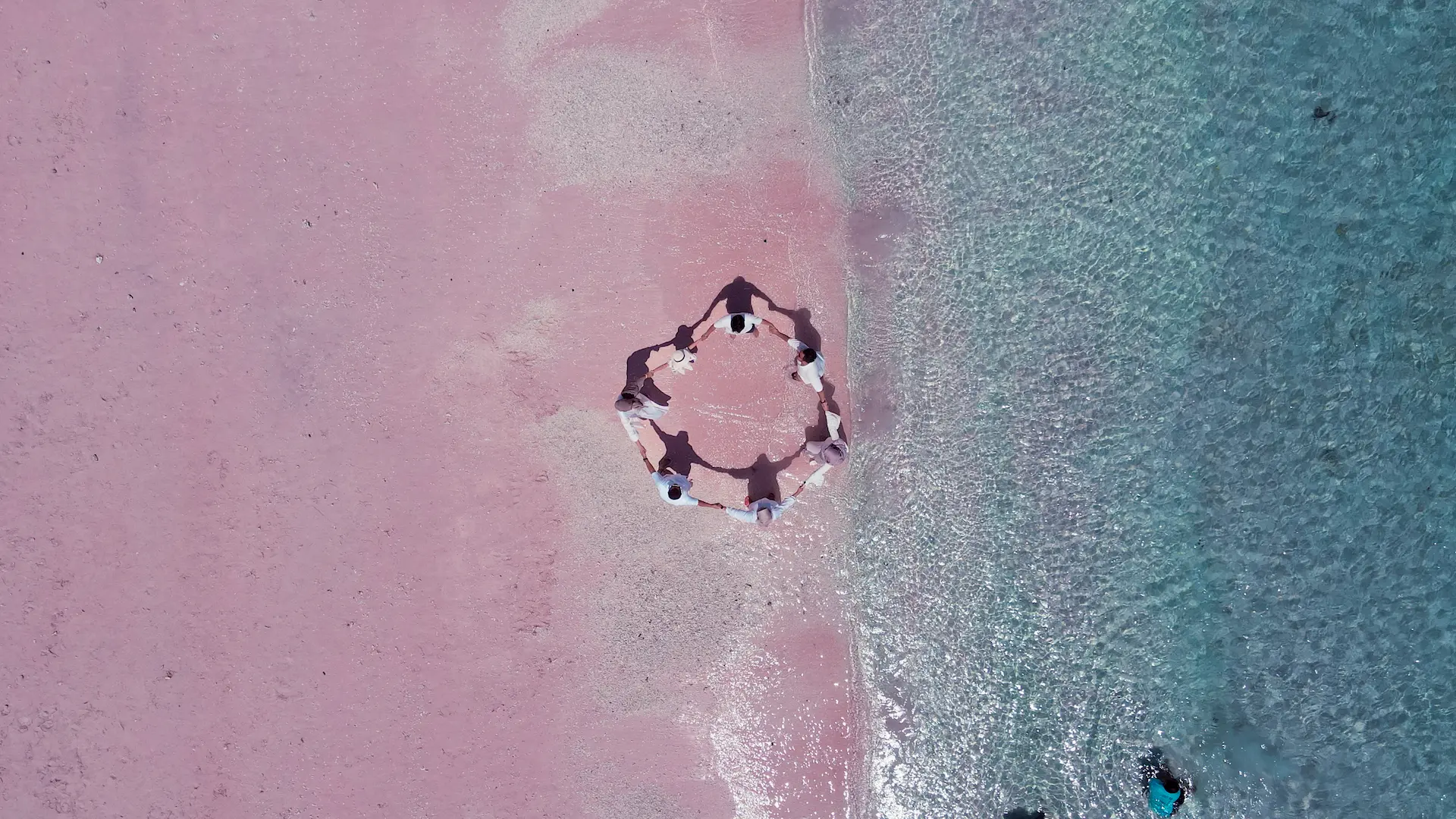 Enjoy the beauty of Pink Beach and its crystal clear water